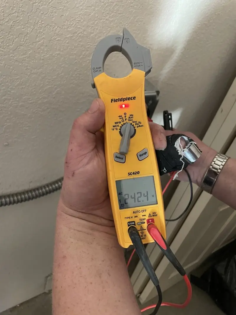 Voltage testing with clamp meter during Electrical Installation Services in Belen